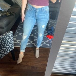 Distressed light wash low rise womens jeans